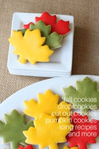 cut out leaf cookies with yellow, red, and green glaze icing