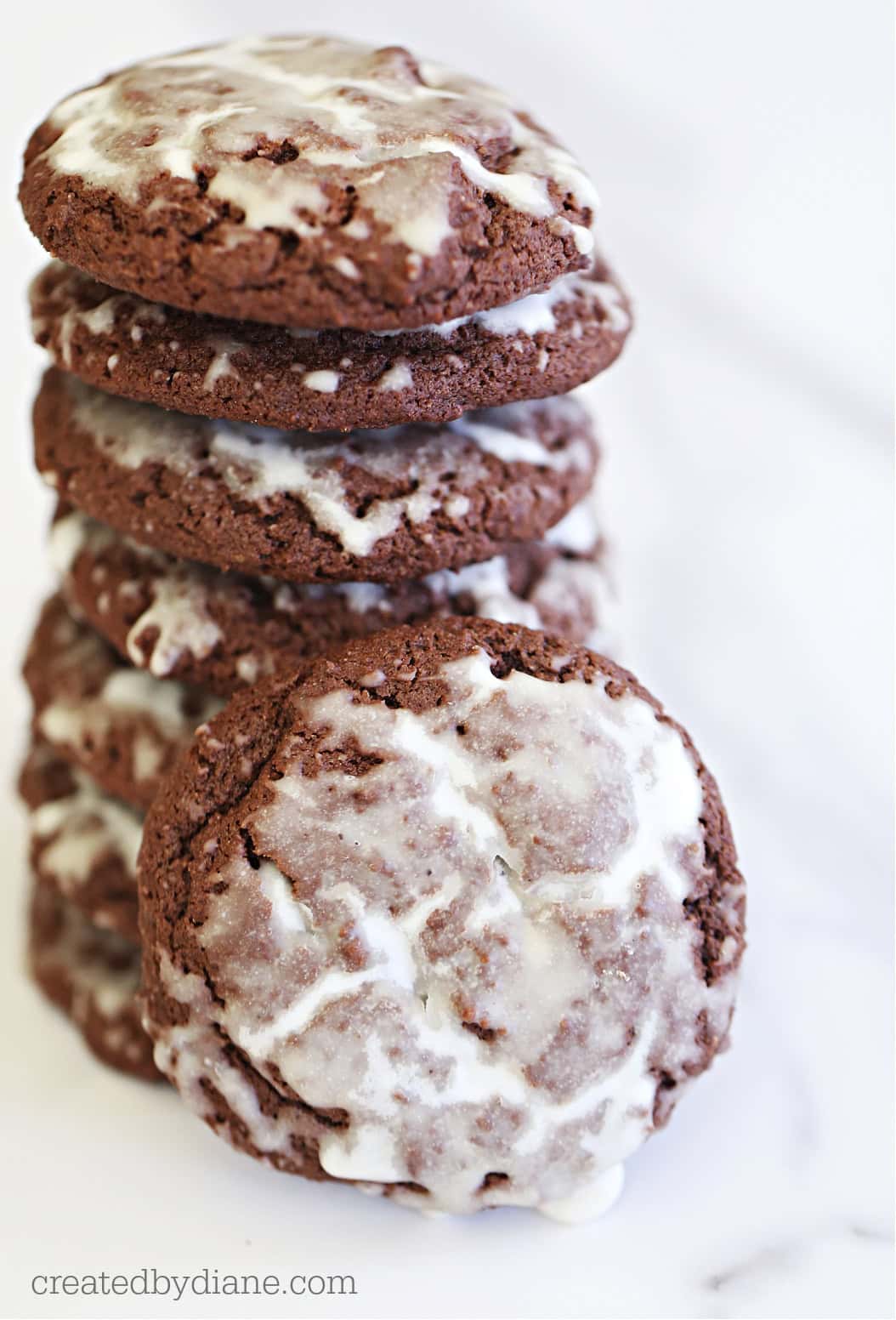 iced chocolate gingerbread drop cookies with bourbon glaze icing from createdbydiane.com