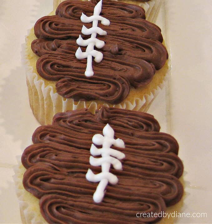 Vanilla cupcakes chocolate football design frosting